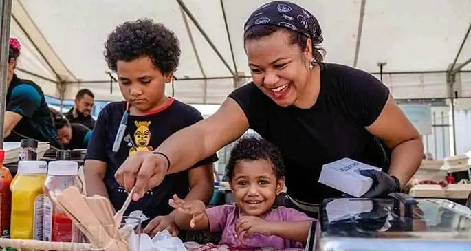 All hands on deck for Spitroast Fiji from left: eldest daughter Dijonay Cokanasiga, Spitroast Fiji owner Vasemaca Cokanasiga and youngest daughter Mlee Cokanasiga