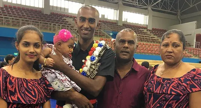 New Fiji Police Force recruit, Kusal Kumar (second from left, carrying baby), with his family during the passing out parade on January 17, 2020. Photo: Renu Radhika