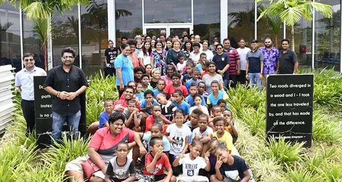Children of Gospel School for the Deaf with family and staff at the Shri Sathya Sai Sanjeevani Medical Centre in Nasese.