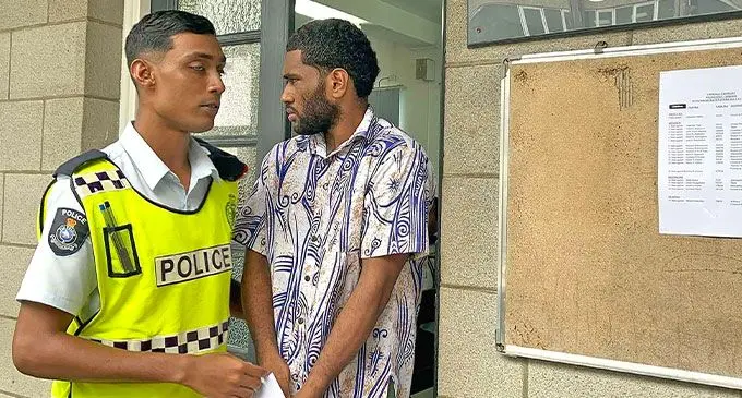 Accused Apolosa Macedru escorted by Police outside the Suva Magistrate’s Court on February 12, 2025. Photo: Beranadeta Nagatalevu