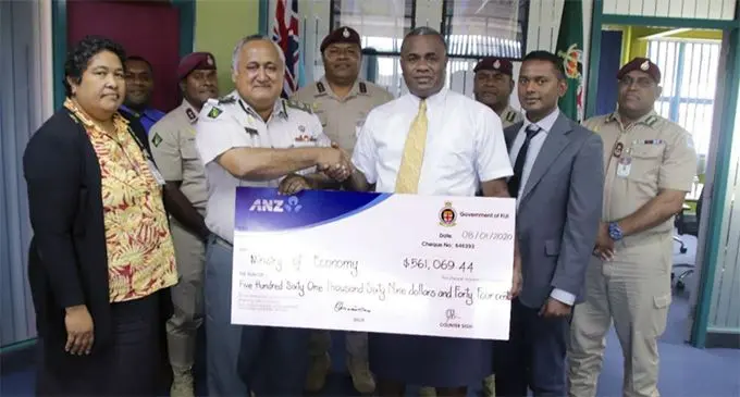 Commissioner of Corrections Commander Francis Kean and his Senior Officers hands over a cheque of $561,069.44 to Ministry of Economy’s Head of Budget Isoa Talemaibua and Budget Analyst Sandip Kumar at the FCS Headquarters.