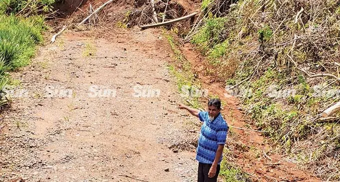 Paipai advisory counselor, Shamshad Ali shows the  area where the landslide occurred at Deo Karan Road in Lautoka. Photo: Nicollete Chambers