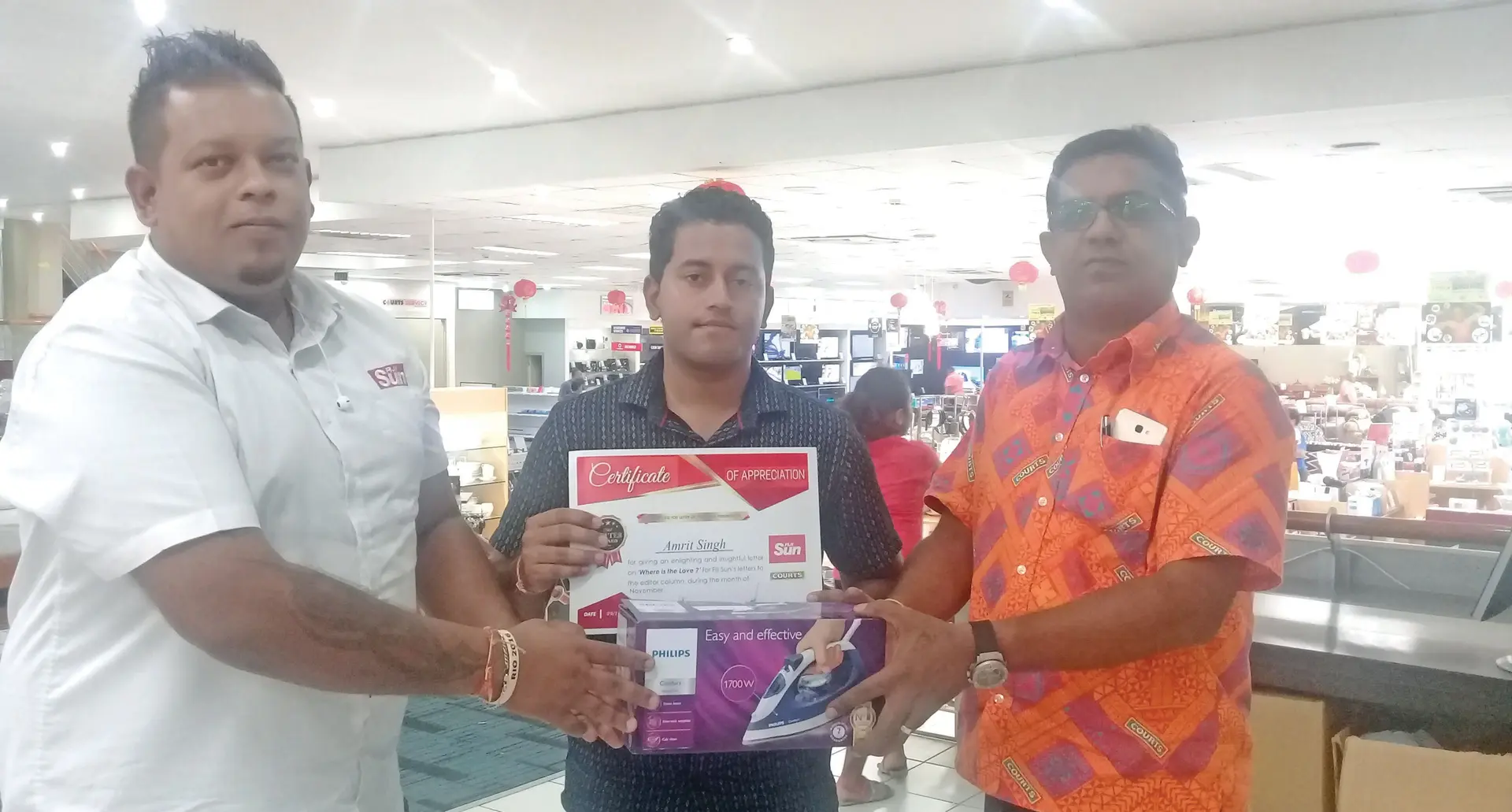 Fiji Sun Marketing Manager Rajiv Raj Winner Amrit Singh and Courts Mega Samabula retail manager Vimlesh Prasad on February 17, 2018. Photo: Lusiana Tuimaisala 