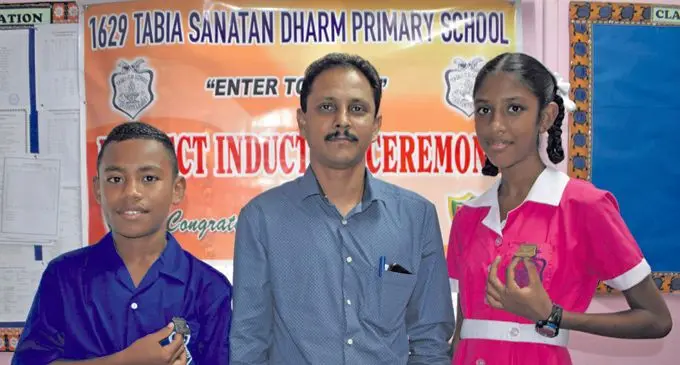 From Left: Tabia Sanatan Dharm Primary School headboy Peni Raicula, headteacher Swatantra Singh and headgirl Tania Nath after the prefect induction in Tabia, Labasa on January 30, 2019. Photo:Shratika Naidu