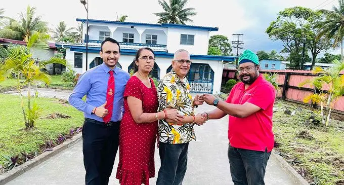 Harcourts Fiji agent, Jasmindar Singh (right) welcoming the Kumar family: Krishneel Kumar (son), Veena Kumar and husband Krishan Kumar at their new home in Vatuwaqa, Suva