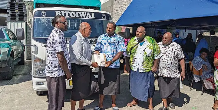 Minister for iTaukei Affairs Ifereimi Vasu (second from left) hands over the vehicle to the village leaders of Nabila. Photo: Mereleki Nai