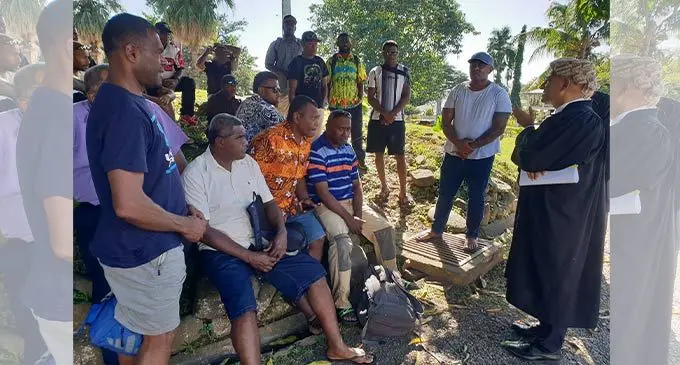 Aman Ravindra Singh speaking to his clients outside the High Court in Lautoka on July 4, 2022. Photo: Nicolette Chambers 