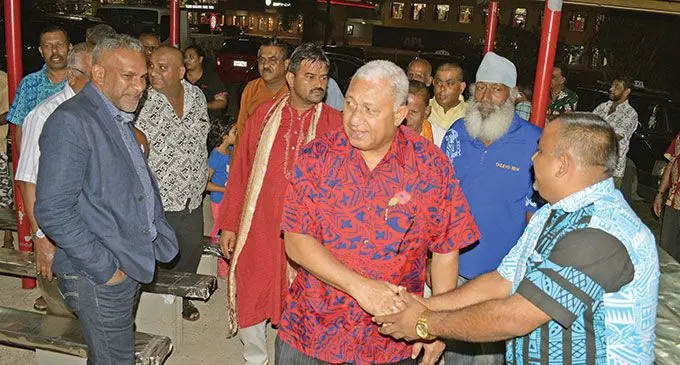FijiFirst party leader and Prime Minister, Voreqe Bainimarama (red bula shirt), with party candidate Faiyaz Koya (front left), and supporters during the party’s campaign launch at the Shree Gopal Sadhu Hanumaan Temple in Nakasi on October 2, 2018.  Photo: Ronald Kumar