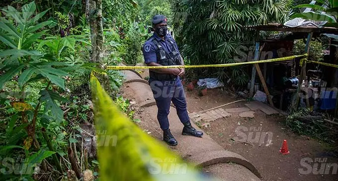 A Police officer stands guard outside the crime scene at Maravu Settlement in Laucala Beach on August 22, 2021. Photo: Leon Lord