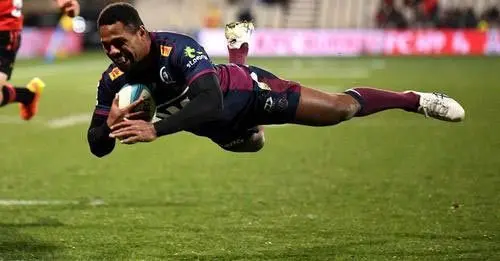 Reds winger Filipo Daugunu dives over to score a try against Crusaders in the Super Rugby Pacific quarterfinal at Orangetheory Stadium in Chirstchurch, last night. Photo: rugby.com.au 