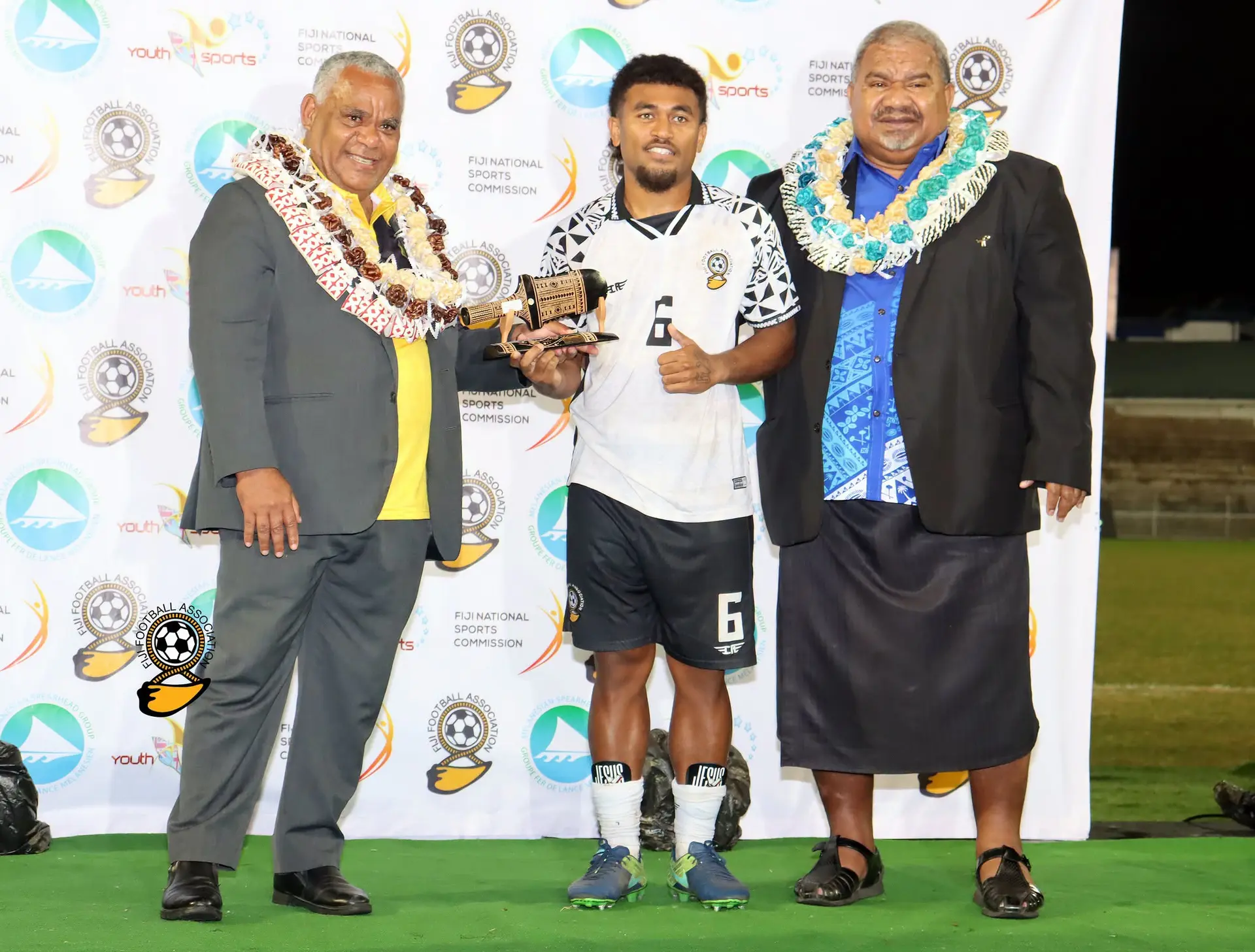 Prime Minister of Vanuatu Jotham Napat (left) Minister for Youth and Sports  Jese Saukuru (right) flanks Thomas Dunn on October 3, 2026. 