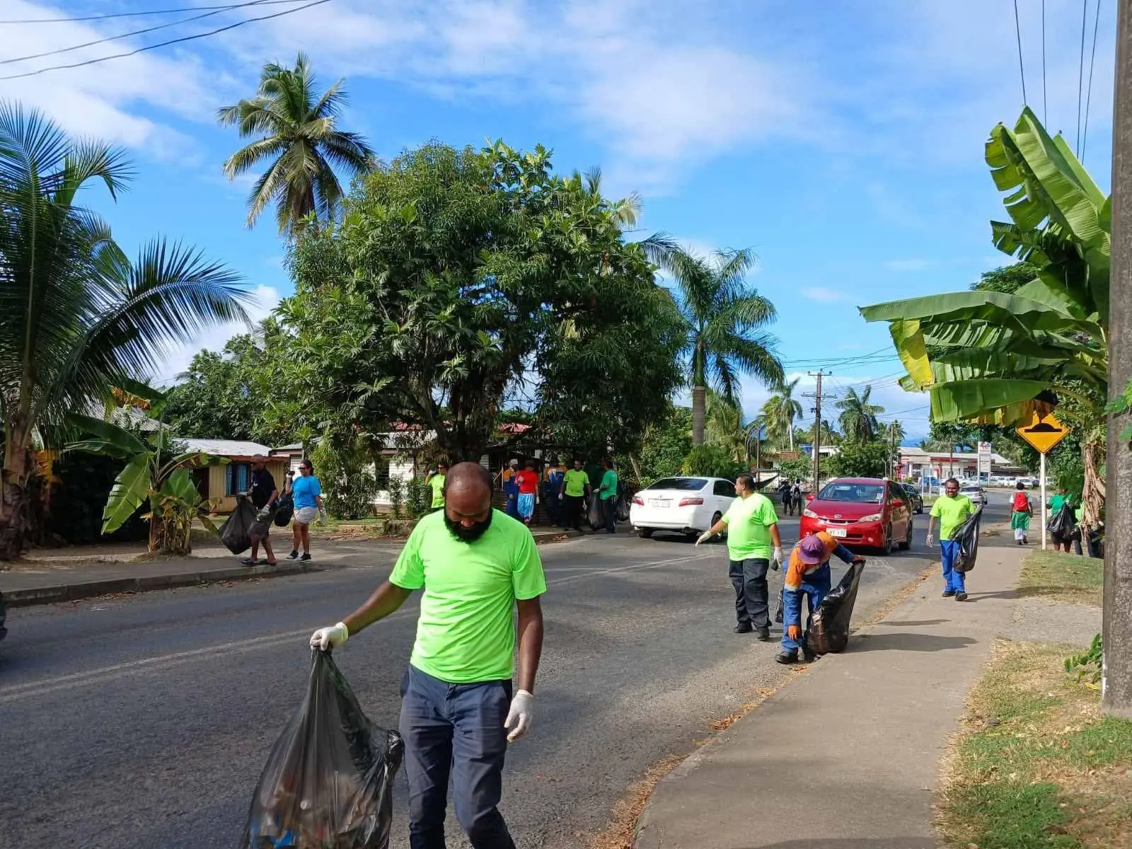 Nadi Town Council staff picking rubbish along the road side in Namotomoto Village, Nadi.