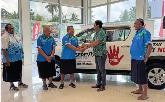 Serevi Academy founder Waisale Serevi {third from left) seals the deal with Asco Motors chief executive officer Ronald Kumar at the Asco Showroom in Nabua, Suva, on March 18, 2025. Photo: Sereana Salato. 