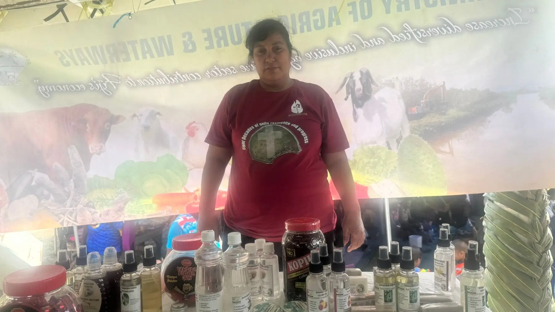 Banaban Virgin Coconut Oil staff Teriataake Tuateira with products on display at Tabwewa Village on December 17, 2025.