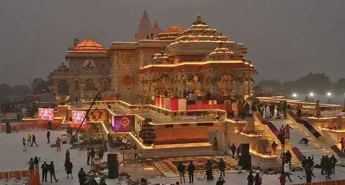 Workers decorate a temple dedicated to Hindu deity Lord Rama with flowers on the eve of the temple’s grand opening in Ayodhya, India on January 21, 2024. Photo: AP