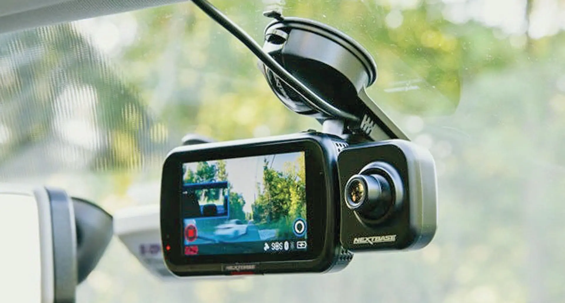 A dash-cam mounted on a windscreen.