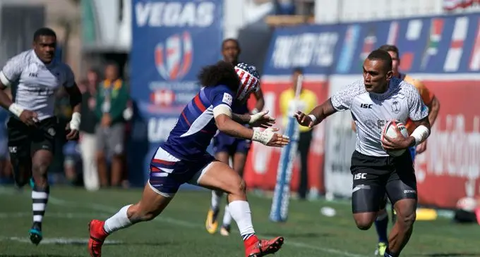 Fiji Airways Fijian 7s wing Eroni Sau tries to fend a USA defender during the USA Sevens Cup semifinal at the Sam Boyd Stadium, Las Vegas in USA, on March 5, 2018. Photo: Bruce Southwick/Zoom Fiji
