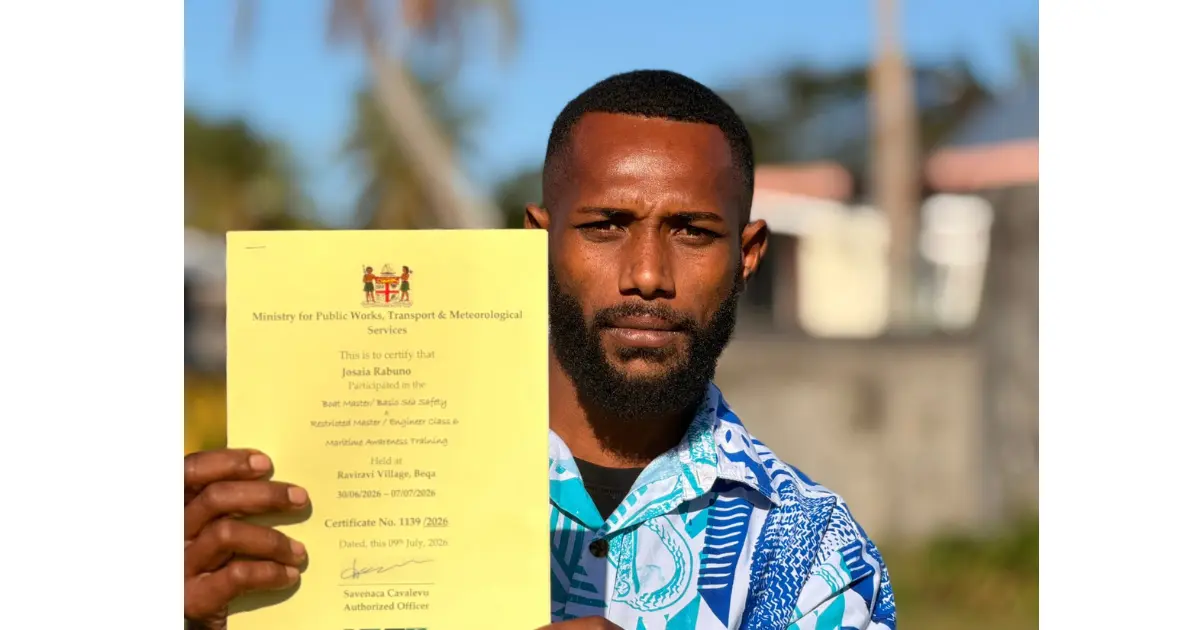 Josaia Rabuno with his certificate at Ekubu Village on Vatulele Island. 