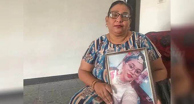 Sunita Wati with a photo of her daughter, Komal Kavita Kumar. Photo: Sosiveta Korobiau