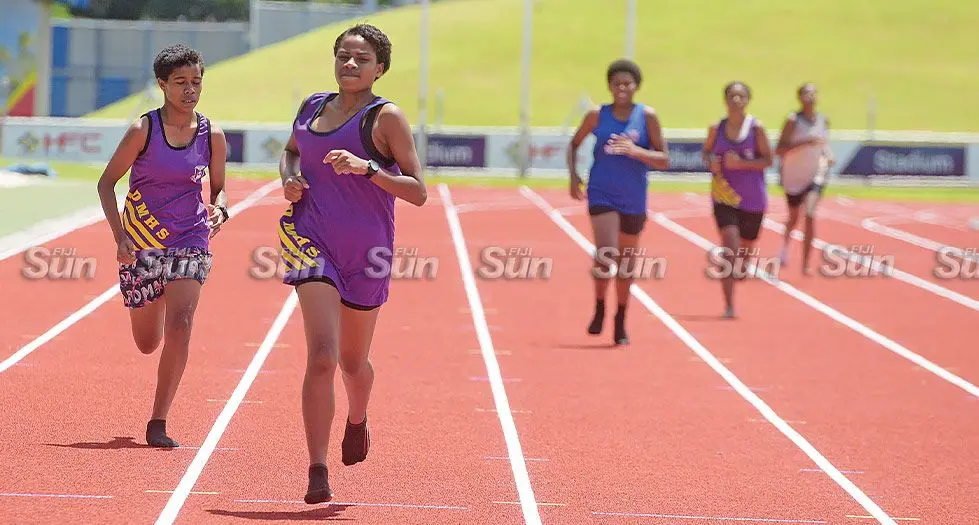 Davuilevu Methodist High School athlete, Siteri Rokoraiova (second from left) won the 400 metres junior girl’s heat at HFC Bank Stadium, Suva, on March 1, 2024. The athletes had to wear socks after they were stopped from wearing their track shoes since they had the wrong spikes.  Photo: Ronald Kumar