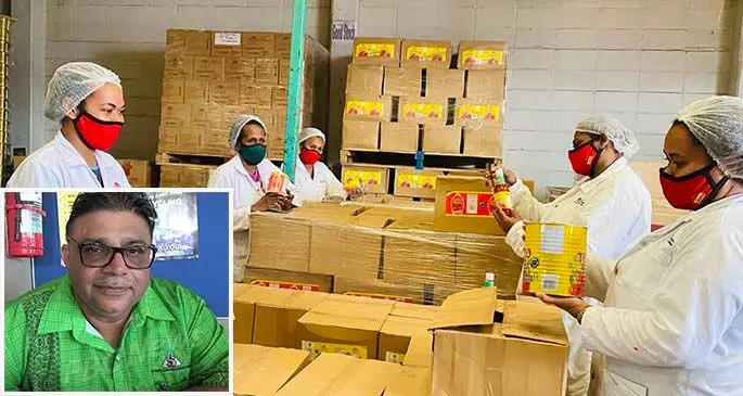Staff members of Food Processors (Fiji) Pte Limited packing tomota sauces. Inset: Food Processors (Fiji) Pte Limited Board Chairman, Raj Sharma