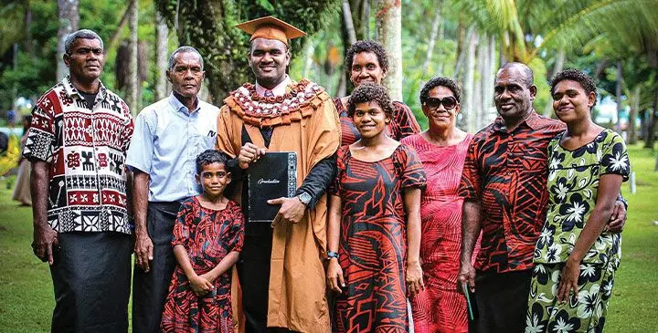 Isikeli Ratubese (fourth from left), with family members during the University of the South Pacific graduation ceremony on April 11, 2025. Photo: Suva City Council