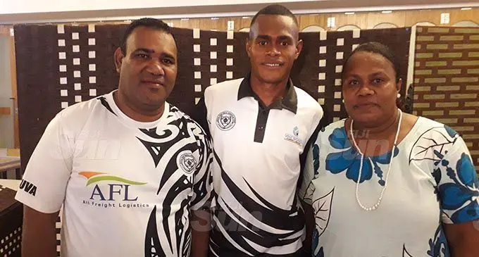Sairusi Nalaubu is flanked by his parenst, dad Sevanaia Turamanu (left) and Mum, Niusita Sigarara during the Suva Football Asscoaition awards night at Central Cuisine, Suva on December 21, 2020. Photo: Sereana Salalo