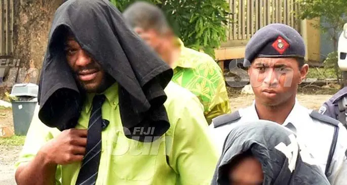 Fiji Bati and Parramatta Eels star winger Maika Sivo is escorted by police as he fronts the Nadi Magistrate Court yesterday. Photo: Waisea Nasokia