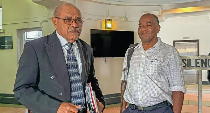 From left: Senior lawyer, Sevuloni Valenitabua and his client, Nikolau Nawaikula having a discussion outside the High Court in Suva on September 4, 2024. Photo: Asenaca Ratu