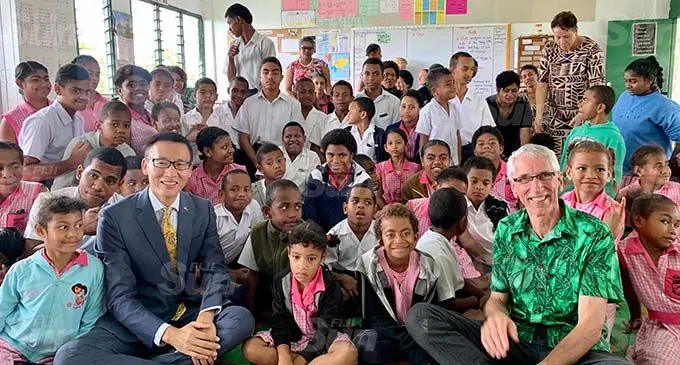 Director of the Chinese Embassy’s Political Division, Li Jiabing ( Front, second from left), Gospel School for the Deaf director, Russell Neate (front right) with students after receiving the donation on October 14, 2020. Photo: Fonua Talei