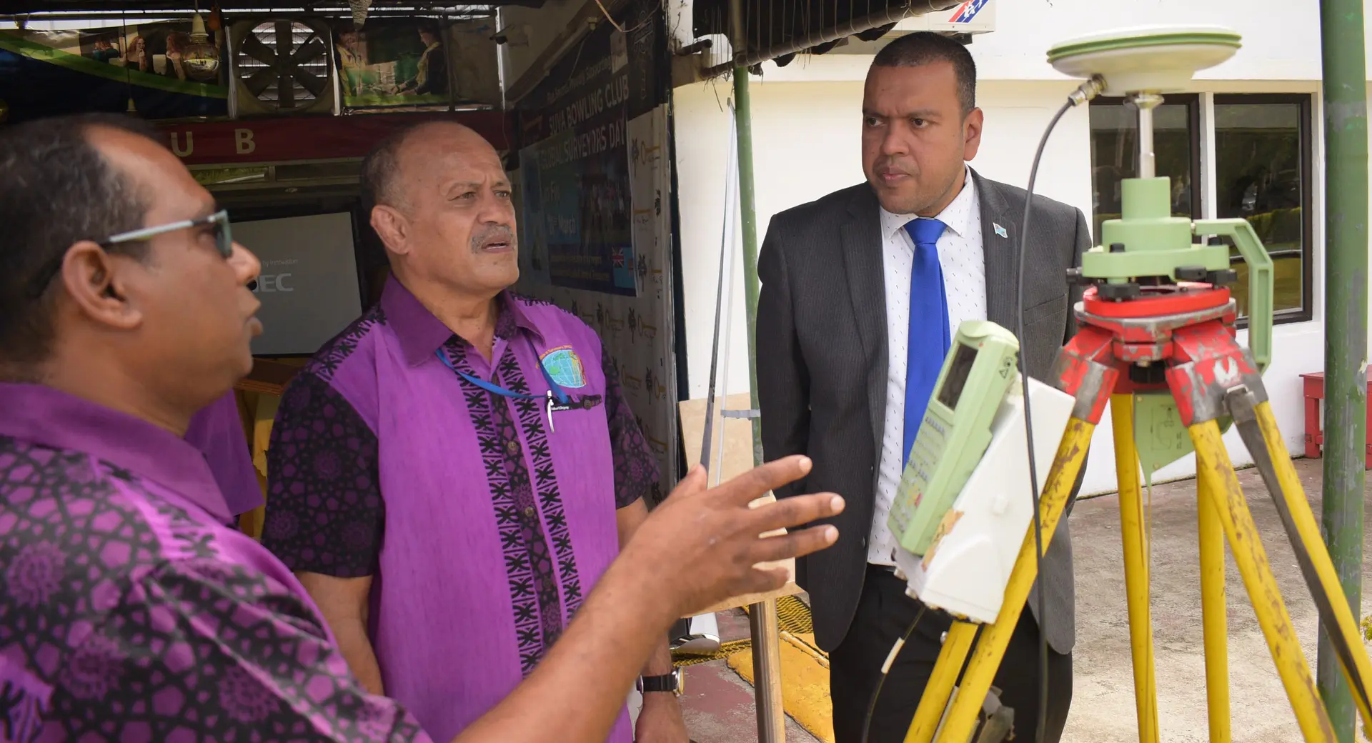 Andrick Lal (left) and Fiji Institute of Surveyors Council President Paserio Samisoni explain the GNSS survey equipment to Minister for Lands Ashneel Sudhakar during Global Surveyors Day on March 21, 2019. Photo: Ronald Kumar.