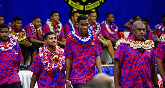 Fiji Airways Fijiana 7s coach and Marist Brothers High School Under-18 technical advisor Saiasi Fuli with captain Banjamin Naivalu during the celebration at the Vodafone Arena, Suva, today. Photo: Leon Lord  