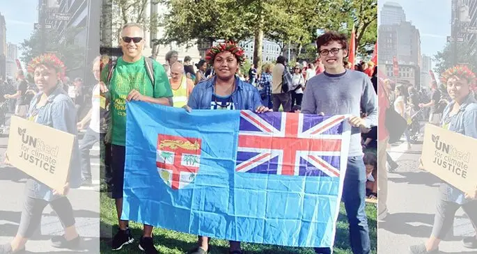 AnnMary Raduva, 15, with two others showcase the Fijian flag during the Global Climate Strike in New York City.
