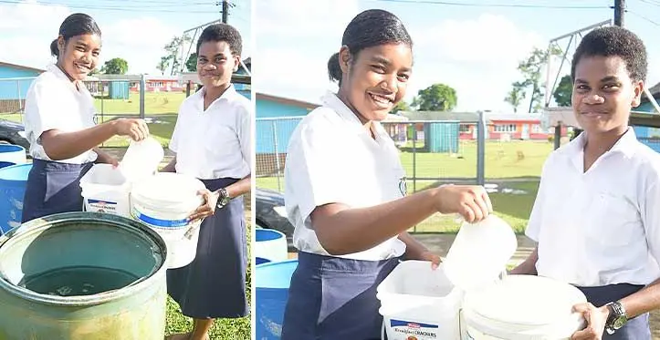 Jeremiah Raibevu College students, Naelani Nagone and Ledua Waqabaca fill water rations following the water cuts in Tacirua, Tamavua on April 13, 2023. Photo: Ronald Kumar
