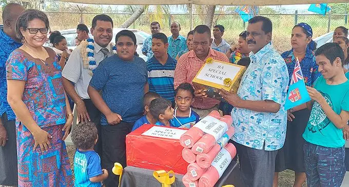 The Minister for Employment, Productivity, Industrial Relations, Youth and Sports Parveen Bala hands over the first aid kits and yoga mats to students and staff of the Ba School for Special Education on October 4, 2022. Photo: Salote Qalubau