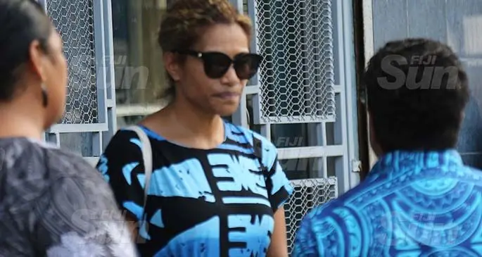 SODELPA MP Lynda Tabuya with CID officers outside the CID office yesterday. Photo: Inoke Rabonu