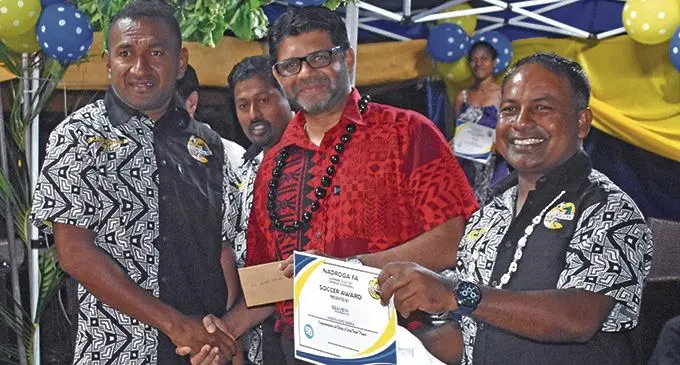 Nadroga football player Kiniviliame Naika receives his award from the Attorney- General Aiyaz Sayed-Khaiyum during the awards night celebration on October 17, 2020. Photo: Waisea Nasokia