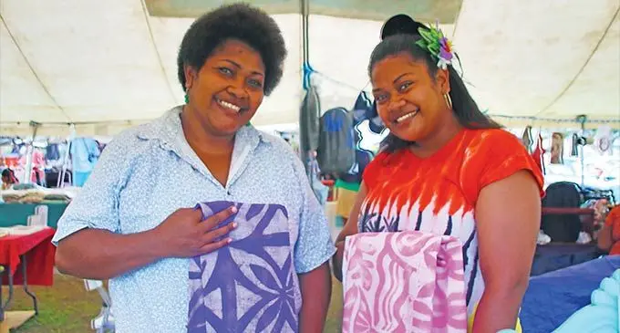 From left: Seinimili Draunitawake with sister Nanise Degei during the University of the South Pacific Market day on November 3, 2022. Photos: Sosiveta Korobiau
