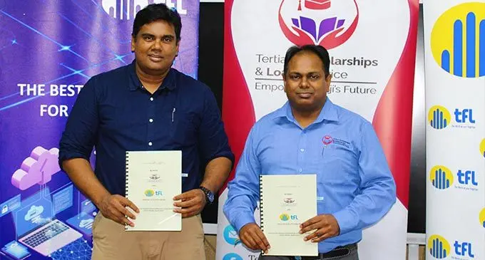 Telecom Fiji chief executive officer, Charles Goundar, with Tertiary Scholarships and Loans Service (TSLS) chief executive officer, Hasmukh Lal, after the signing of the agreement. Photo: TSLS