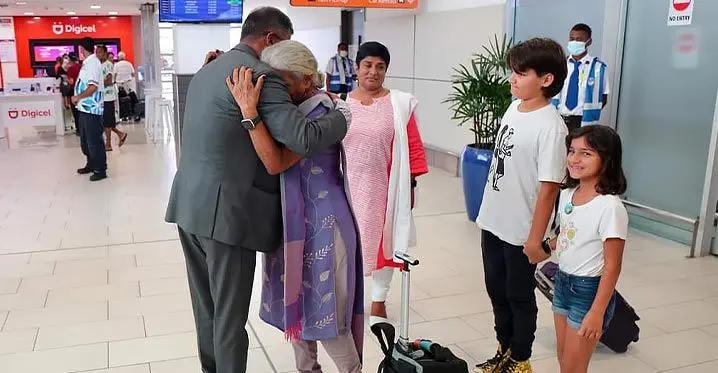 Deputy Prime Minister and Minister for Finance, Biman Prasad, greets the late Dr Brij Lal’s wife, Padma Lal, and her family at the Nadi International Airport on February 22, 2023.