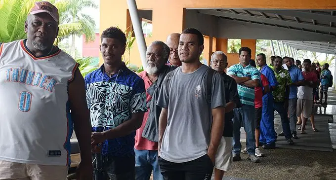 Eremasi Lolo (left), was one of many who waited in line to be served at the Land Transport Authority head office in Valelevu on May 4, 2020 as the authority closed several branches.  Photo: Ronald Kumar