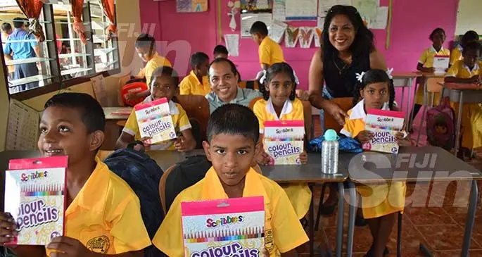 Company director Doreen Yee and son, Richard Yee (right) with Year two students of Nadele Public School on January 13, 2020. Photo: Mereleki Nai