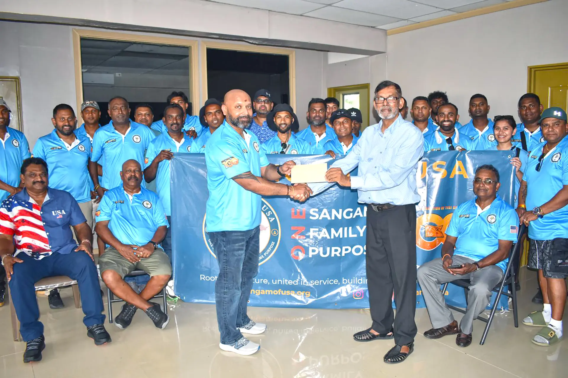 United States of America TIV Sangam president Arvindra Reddy hands over a cheque to Golden Age Home Board of Visitors secretary Selwa Nandan on April 1,2026.