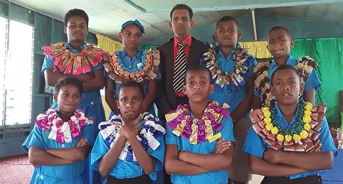 Front from left: Waibogi Wainadiro Primary School student prefects Jilia Lewasusu, Iona Rokowailoa, Draunimasi Visili, and Aminiasi Tuinalia. Standing from left: Vilisite Vaseva, head girl Malania Lewalau, head teacher Robin Dayal, head boy Tadeo Gabiriele and Nikola Kogavou. 