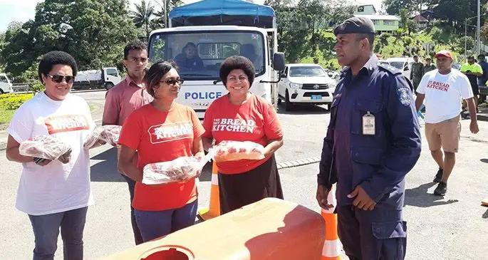 Hot Bread kitchen staff visit the Sawani checkpoint delivering hot cross buns to Police officers. Photo: Wati Talebula