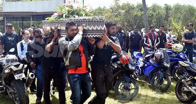 Bikers carry the casket of Hua 'Jerry' Tao at the Nadovi cemetery outside Nadi town yesterday. Photo: Waisea Nasokia