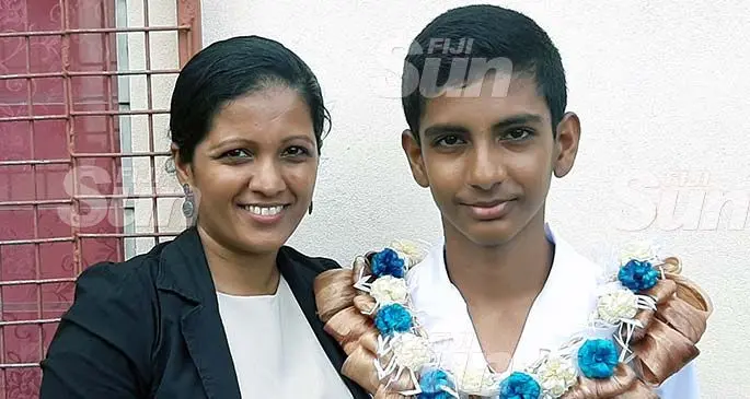 Saint Teresa Primary School Head Boy Arnav Kumar with his mother Shalini Kumar after the prefect induction ceremony on January 24,2019. Photo: Salote Qalubau