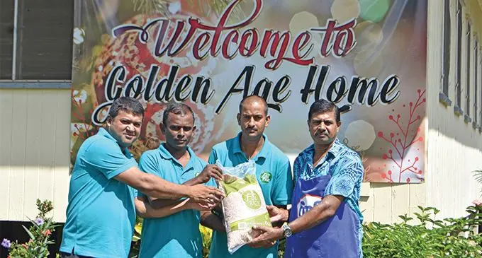 From left: Fiji Rice Limited general manager Ashrit Pratap with workers, Sujeshwar Dutt, Niteshwar Chandra, handing over the package to Golden Age Home - Labasa chef, Jay Nand. Photo: Laisa Lui