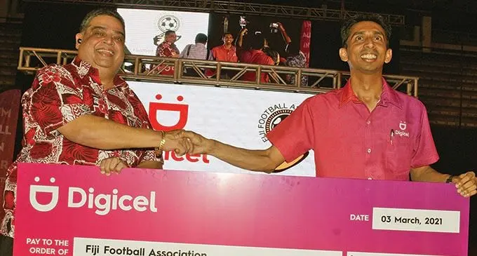 From left: Fiji Football Association president Rajesh Patel receives the sponsorship cheque from Digicel chief executive officer Farid Mohammed during the official annoucement at the FMF Gym, Suva, on March 3, 2021. Photo: Ronald Kumar