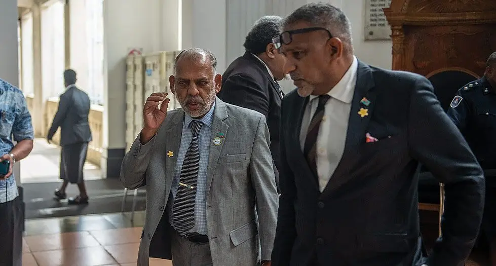 Minister for Employment, Productivity and Industrial Relations Agni Deo Singh (left), and Opposition MP Faiyaz Koya outside Parliament on May 23, 2024. Photo: Leon Lord.